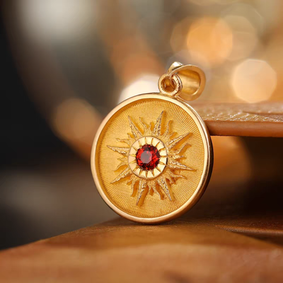 Collector's Eye of the Sun pendant: 18K gold garnet